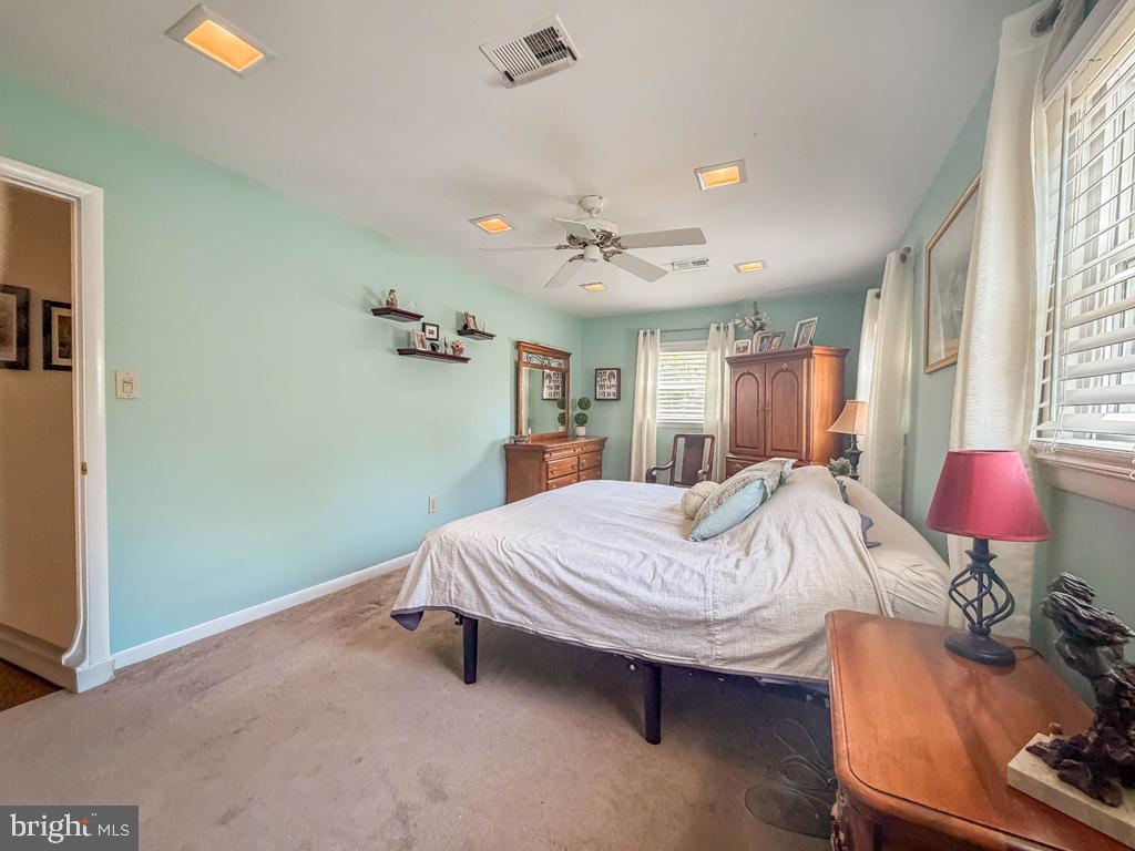 925 Big Oak Road Yardley, PA 19067 - Photo 27 of 51 a bed room with a bed window and couch