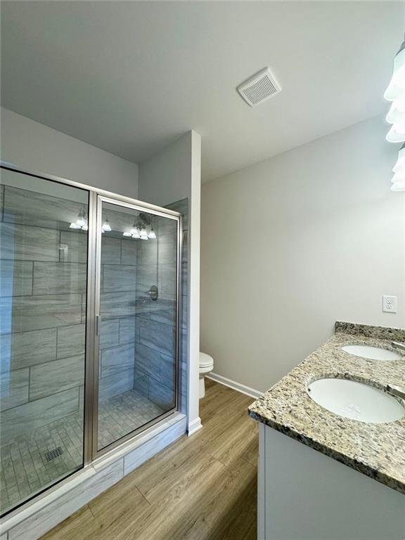 883 Dortch Road Eastanollee, GA 30538 - Photo 16 of 29 a bathroom with a granite countertop sink and shower