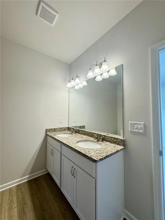883 Dortch Road Eastanollee, GA 30538 - Photo 17 of 29 a bathroom with a granite countertop sink and a mirror