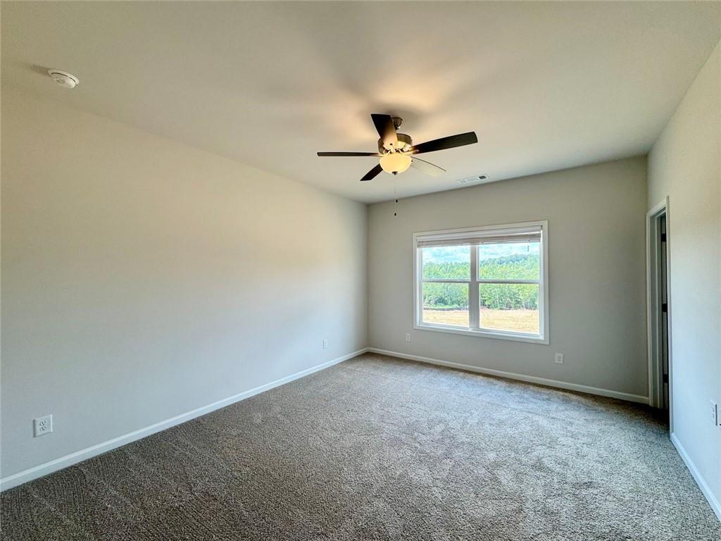 883 Dortch Road Eastanollee, GA 30538 - Photo 19 of 29 an empty room with a window and a fan