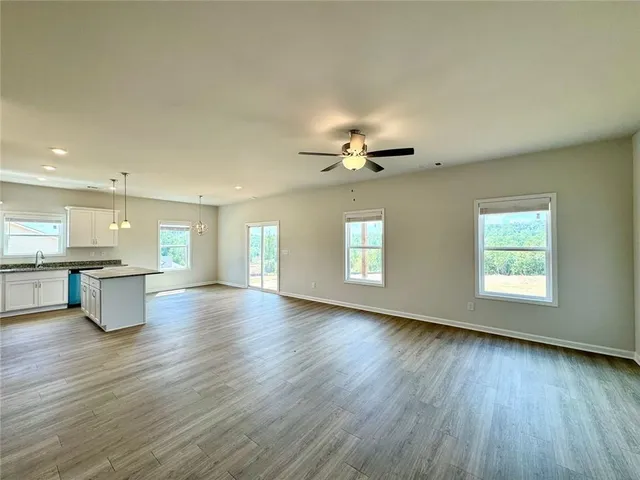 a view of kitchen and dining room with wooden floor