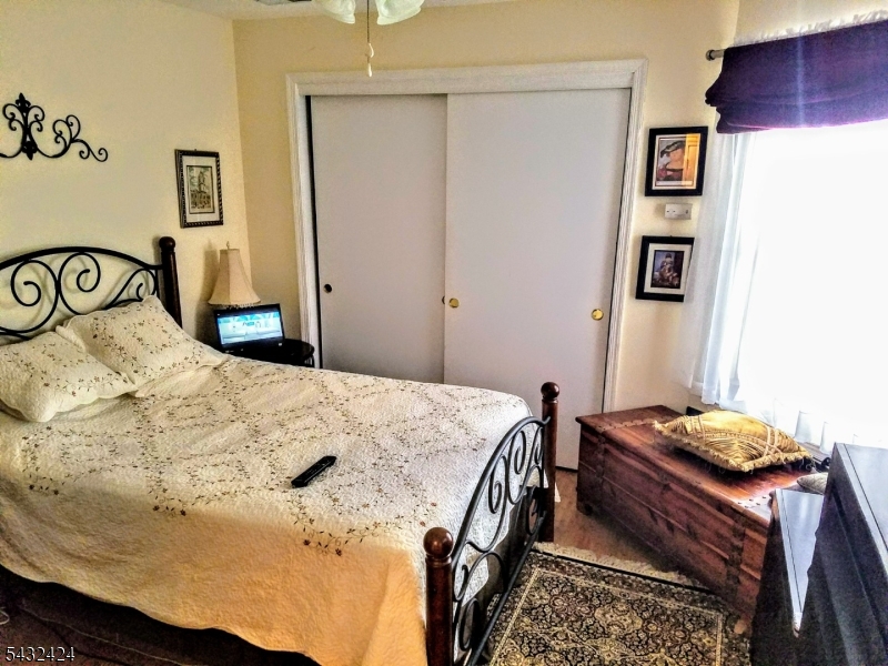 13 Ray Court Bedminster, NJ 07921 - Photo 6 of 8 a bedroom with a bed and a table in it