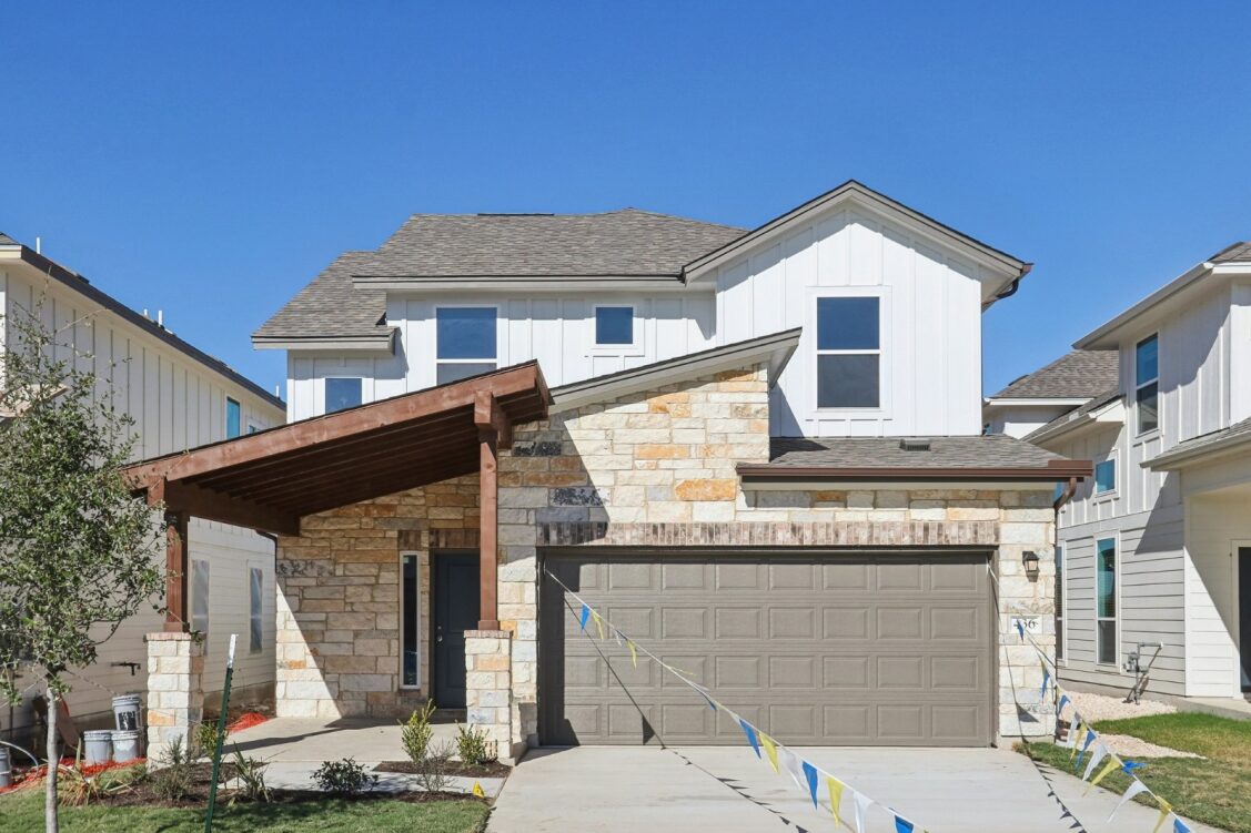 11224 Zip Cochise Way Manor, TX 78653 - Photo 11 of 40 a front view of a house with garage
