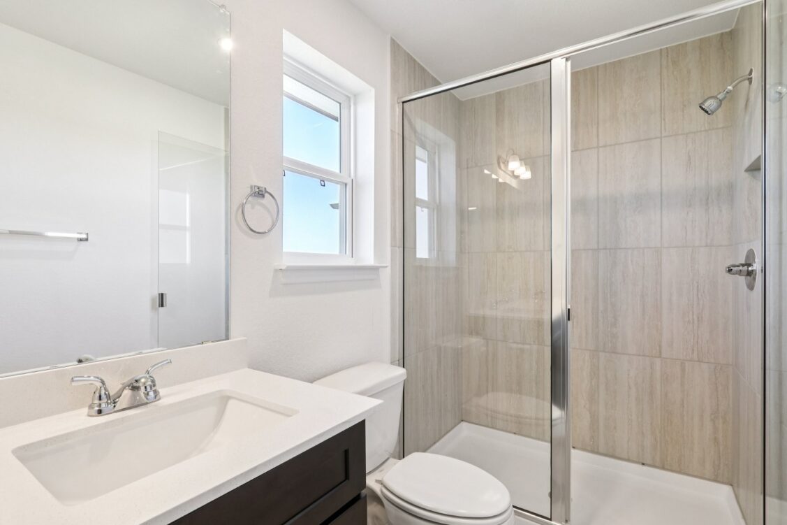 11224 Zip Cochise Way Manor, TX 78653 - Photo 35 of 40 a bathroom with a sink toilet and shower
