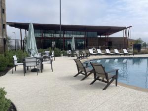 11224 Zip Cochise Way Manor, TX 78653 - Photo 8 of 40 a building outdoor space with patio furniture and potted plants