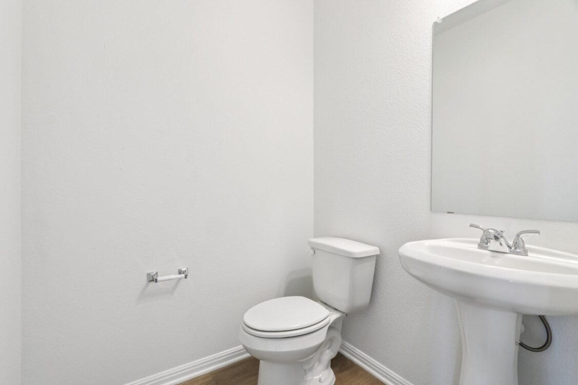 11224 Zip Cochise Way Manor, TX 78653 - Photo 15 of 40 a bathroom with a sink toilet and a mirror