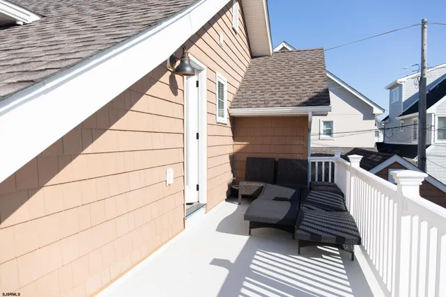 a view of a balcony with furniture