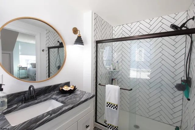 a bathroom with a sink and a mirror