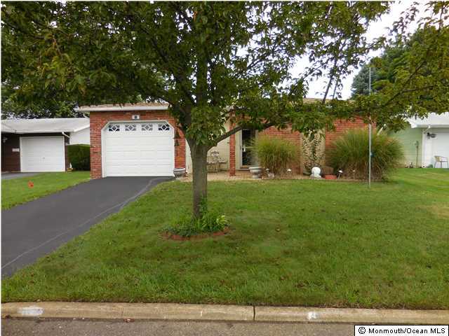 12 Phillips Road Brick, NJ 08724 - Photo 1 of 19 a front view of a house with garden
