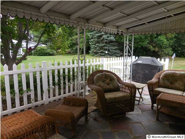 12 Phillips Road Brick, NJ 08724 - Photo 13 of 19 a balcony with furniture and a garden