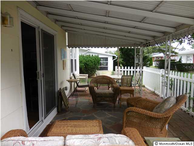 12 Phillips Road Brick, NJ 08724 - Photo 14 of 19 a outdoor space with patio the couches and a dining table with garden view