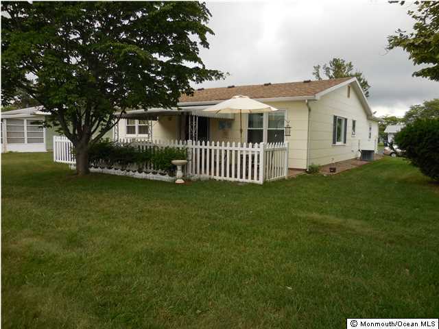 12 Phillips Road Brick, NJ 08724 - Photo 15 of 19 a front view of a house with a garden