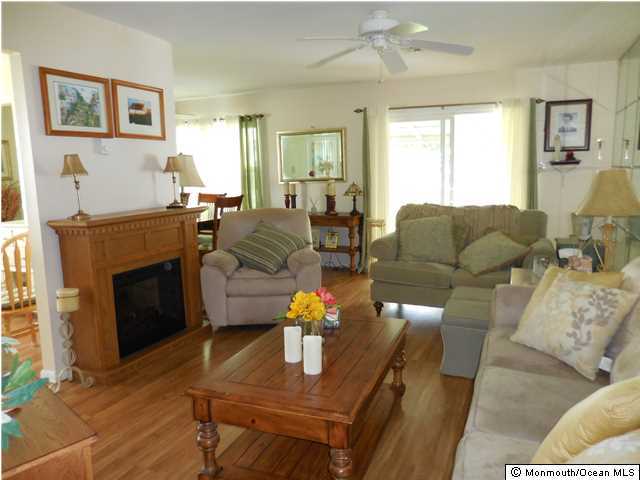 12 Phillips Road Brick, NJ 08724 - Photo 8 of 19 a living room with furniture and a fireplace