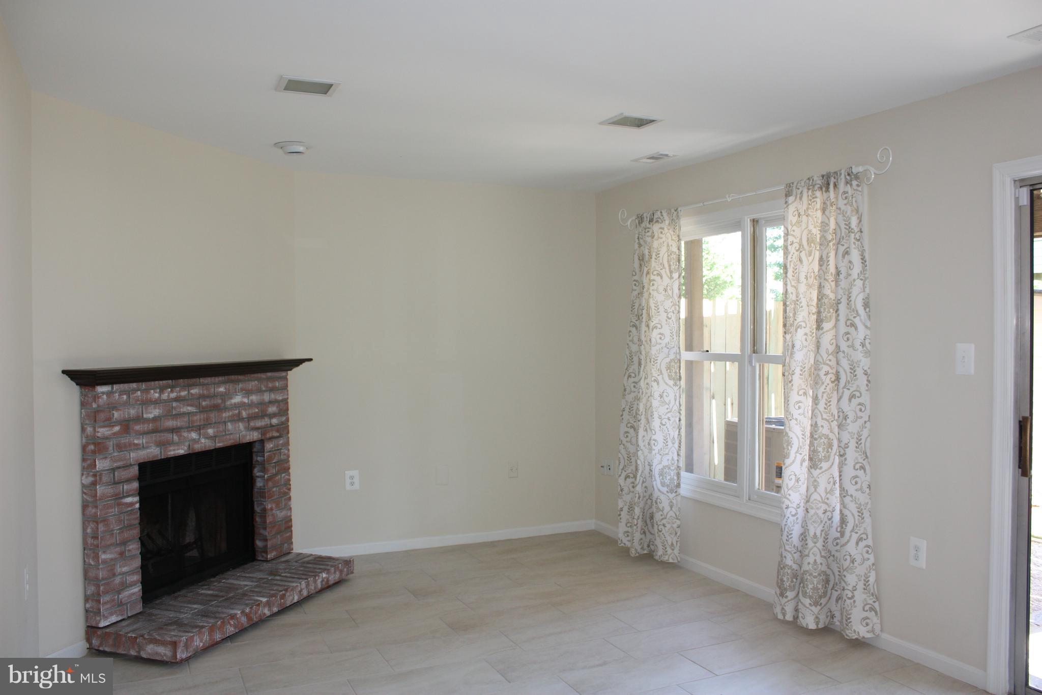 7305 Rokeby Drive Manassas, VA 20109 - Photo 5 of 30 Rec Room with Fireplace