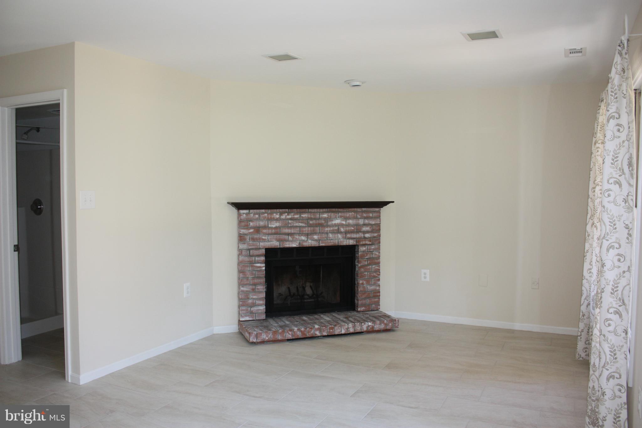 7305 Rokeby Drive Manassas, VA 20109 - Photo 6 of 30 Entry Level Rec Rm with Wood Burning Fireplace