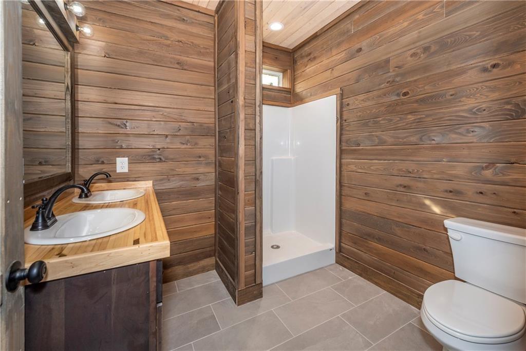1041 Astro Court Northeast Ranger, GA 30734 - Photo 37 of 52 a bathroom with a sink toilet and shower