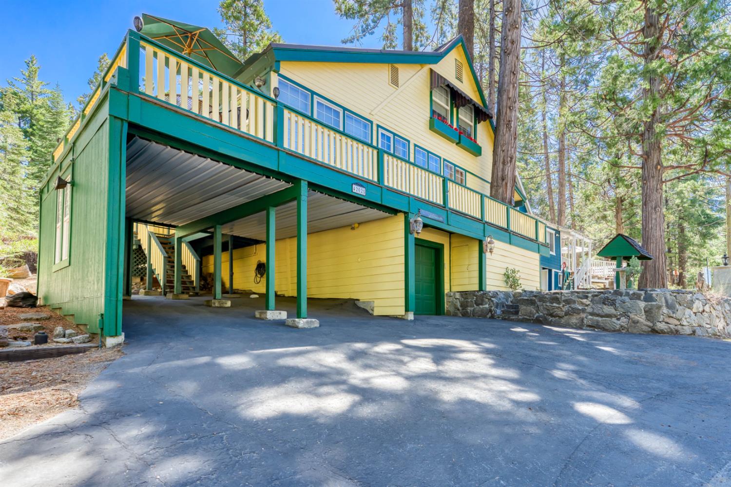 42025 Tollhouse Road Shaver Lake, CA 93664 - Photo 9 of 64 a view of a building with a porch