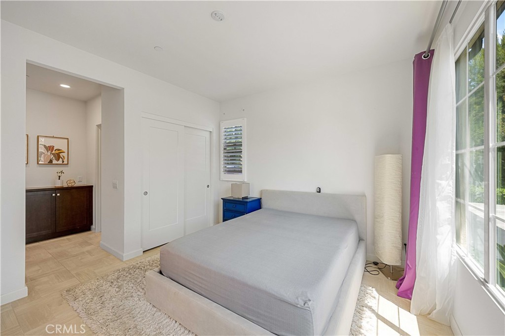 100 Barrington Irvine, CA 92618 - Photo 18 of 30 a bedroom with a bed and a view of kitchen