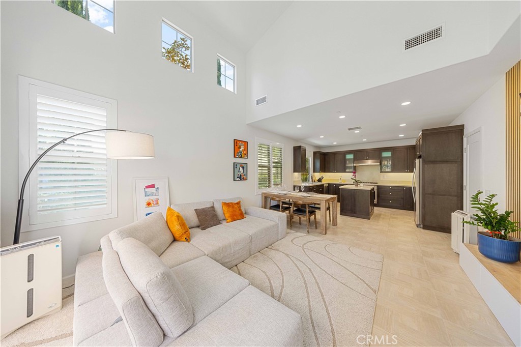 100 Barrington Irvine, CA 92618 - Photo 4 of 30 a living room with furniture kitchen and a window