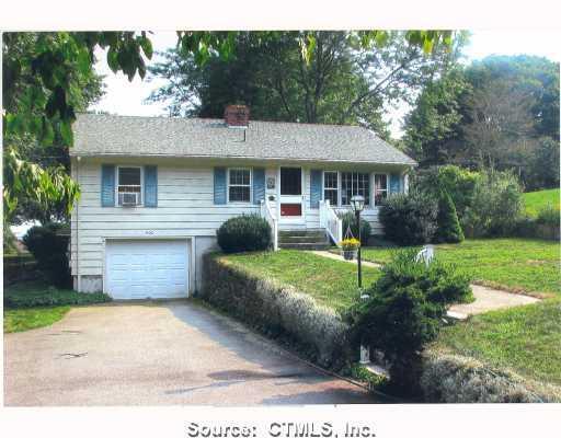 600 Noank Road Groton, CT 06355 - Photo 1 of 1 a front view of a house with a yard and garage