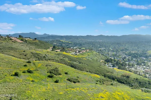 a view of a city with mountains in the background