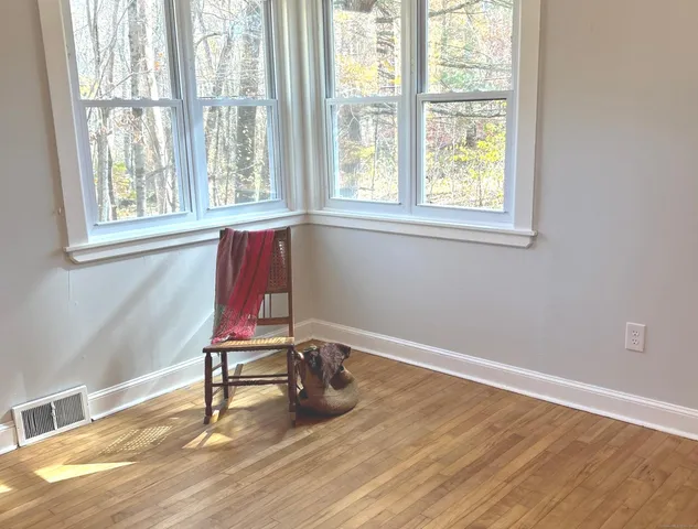 a view of kitchen and dining room with windows