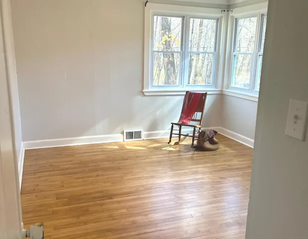 a room with gym equipment and a window
