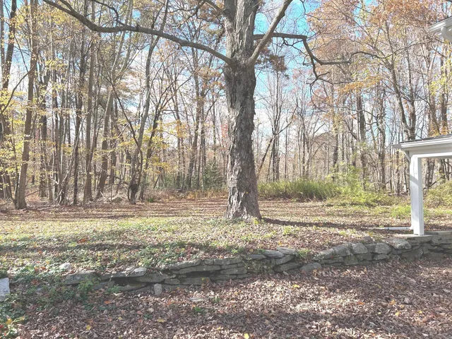 a bathroom with a toilet sink and shower