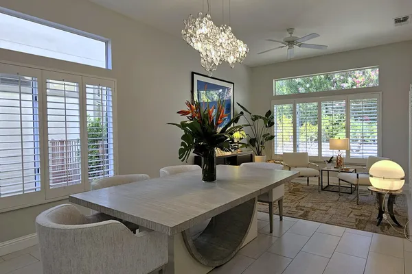 a dining room with furniture and window