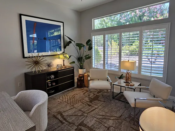 a living room with furniture and a window