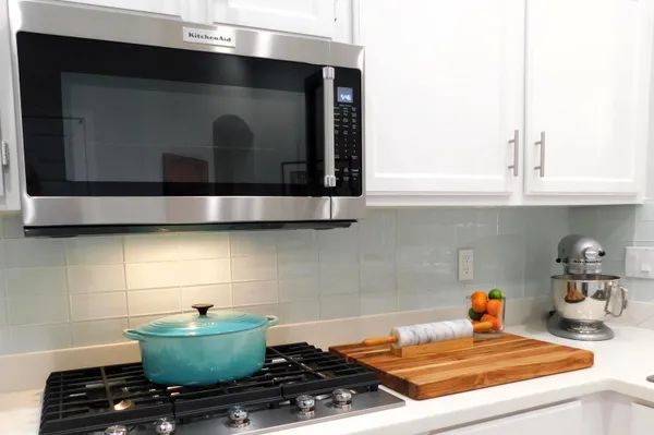 a kitchen with a stove and a microwave