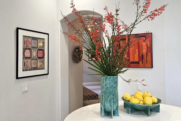 a vase of flowers sitting on a table