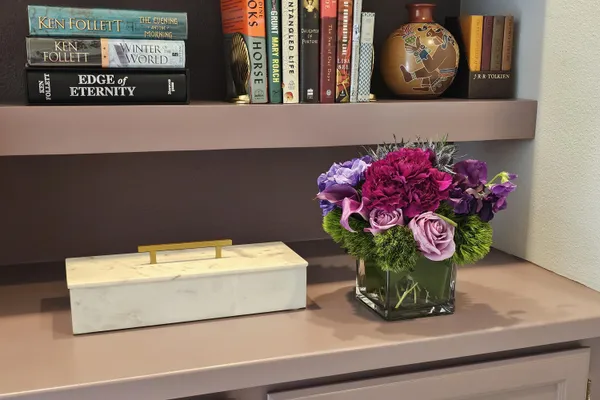 a bedroom with a bed and a lamp