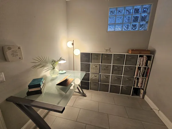 a backyard of a house with table and chairs