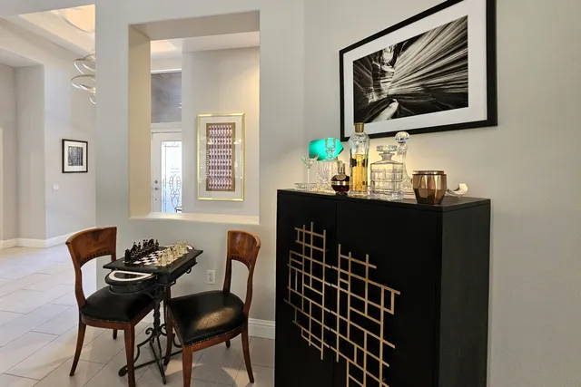 a kitchen with cabinets stainless steel appliances and a counter space