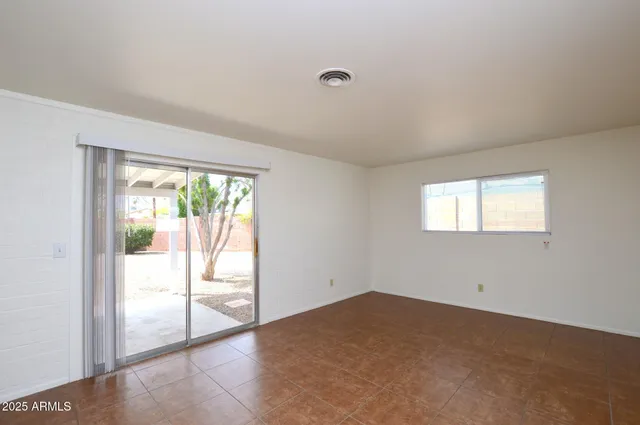 a view of an empty room and window