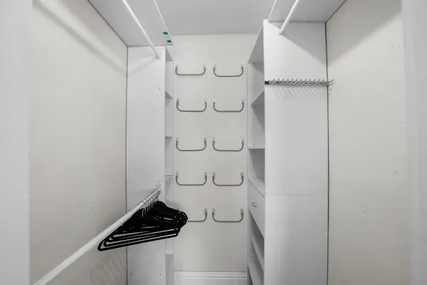 a bedroom with furniture and a chandelier