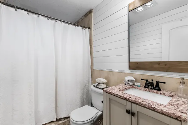 a view of a backyard with potted plants