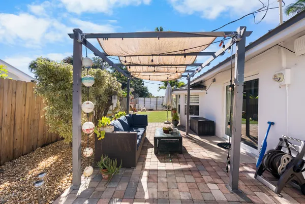 a view of outdoor dining space with furniture and wooden floor