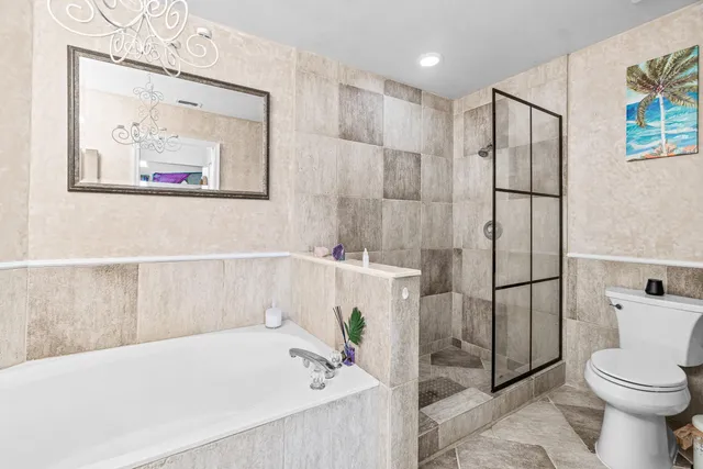 a bathroom with a sink toilet and a mirror