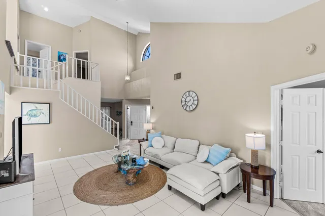 a living room with furniture and a table