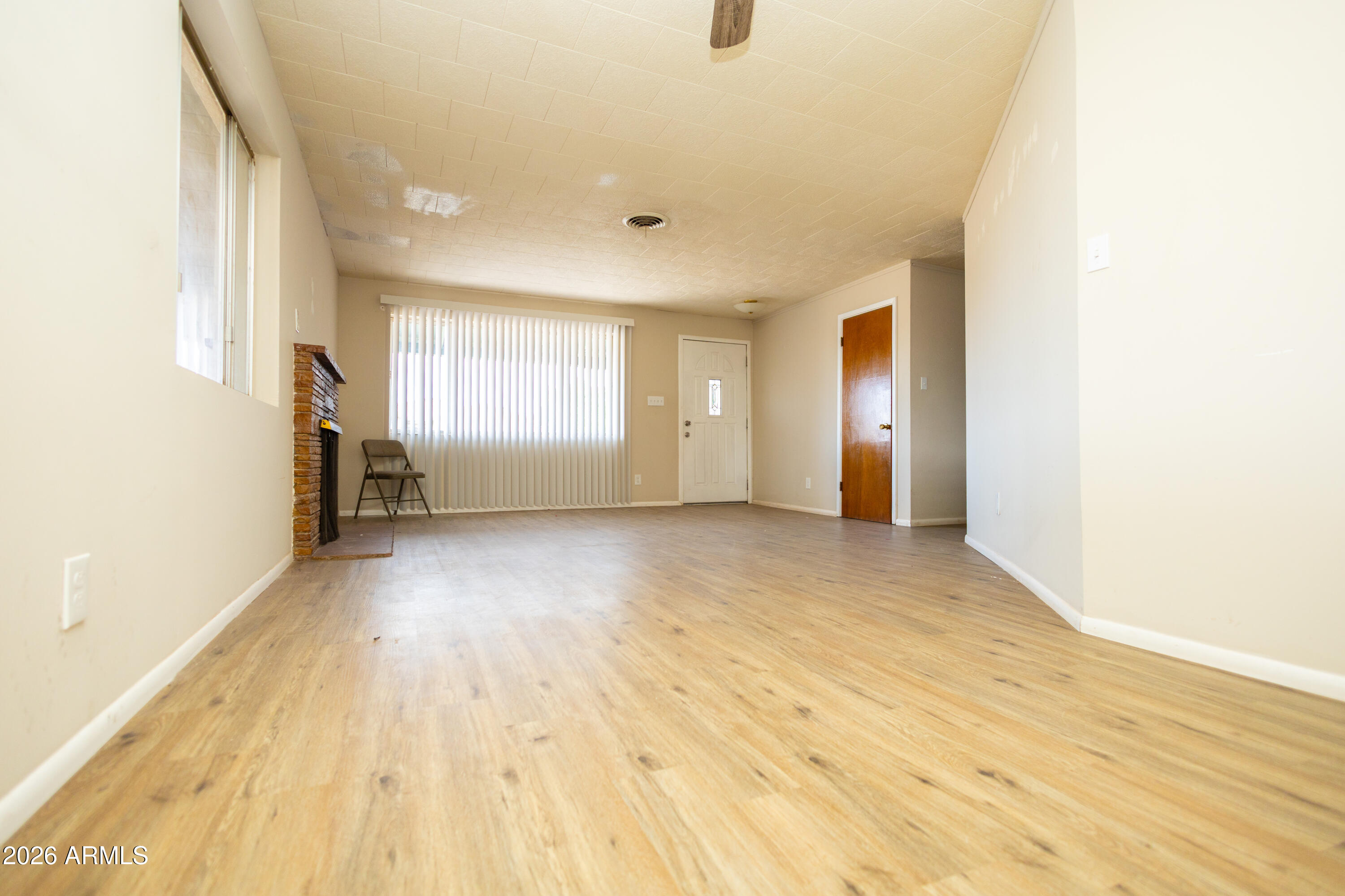 1626 11th Street Douglas, AZ 85607 - Photo 13 of 30 a view of empty room with wooden floor