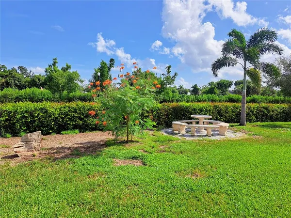 a view of a garden with houses