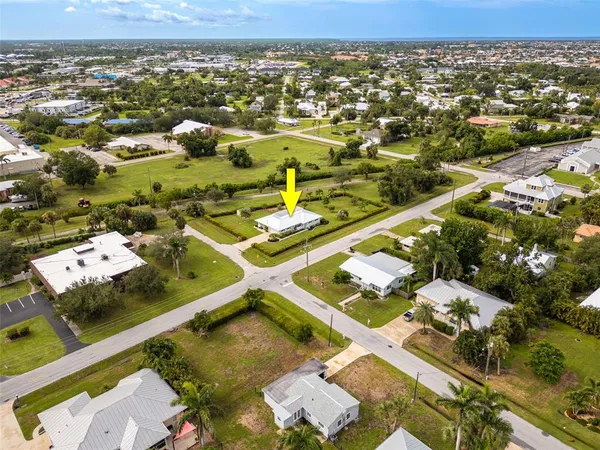 an aerial view of residential houses with outdoor space