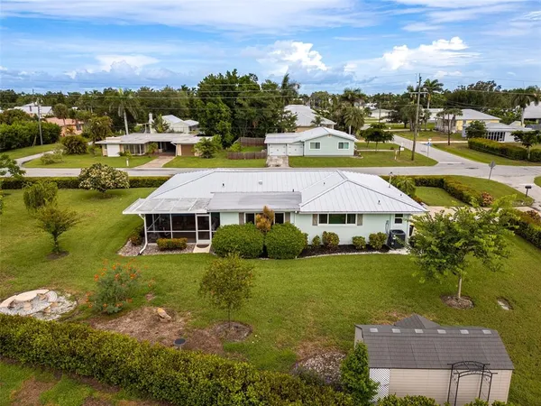 an aerial view of multiple house with a garden