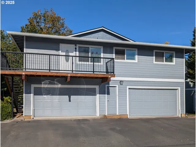 a front view of a house with a garage