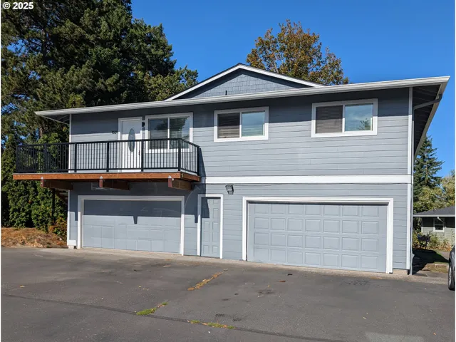 a front view of a house with a garage
