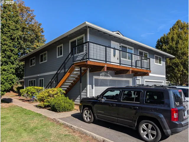 a front view of a house with parking space