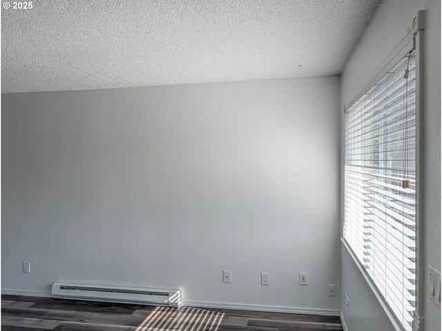 a view of a room with rack and a window