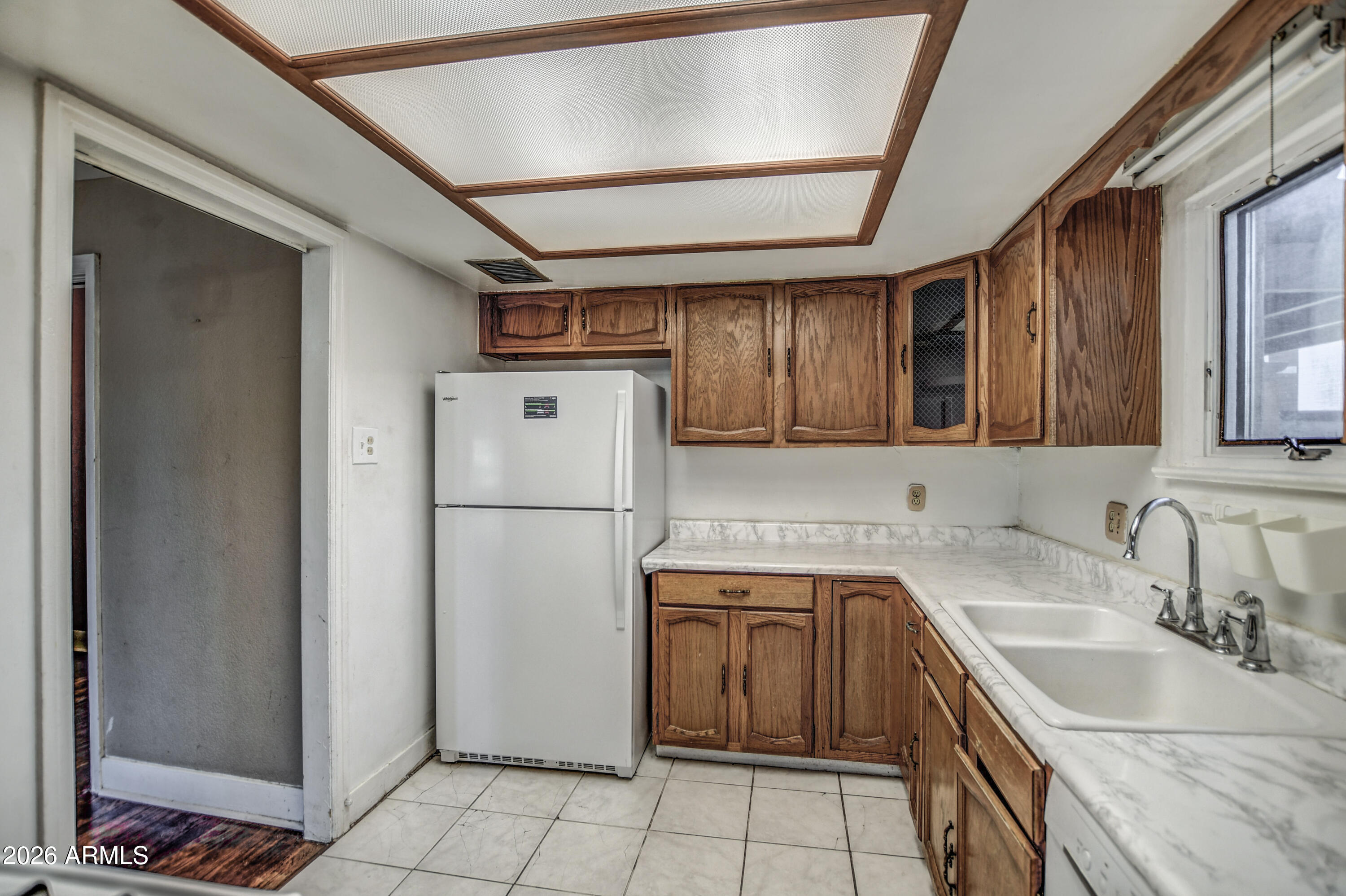384 East Windsor Avenue Phoenix, AZ 85004 - Photo 28 of 42 a kitchen with a sink a refrigerator and a sink